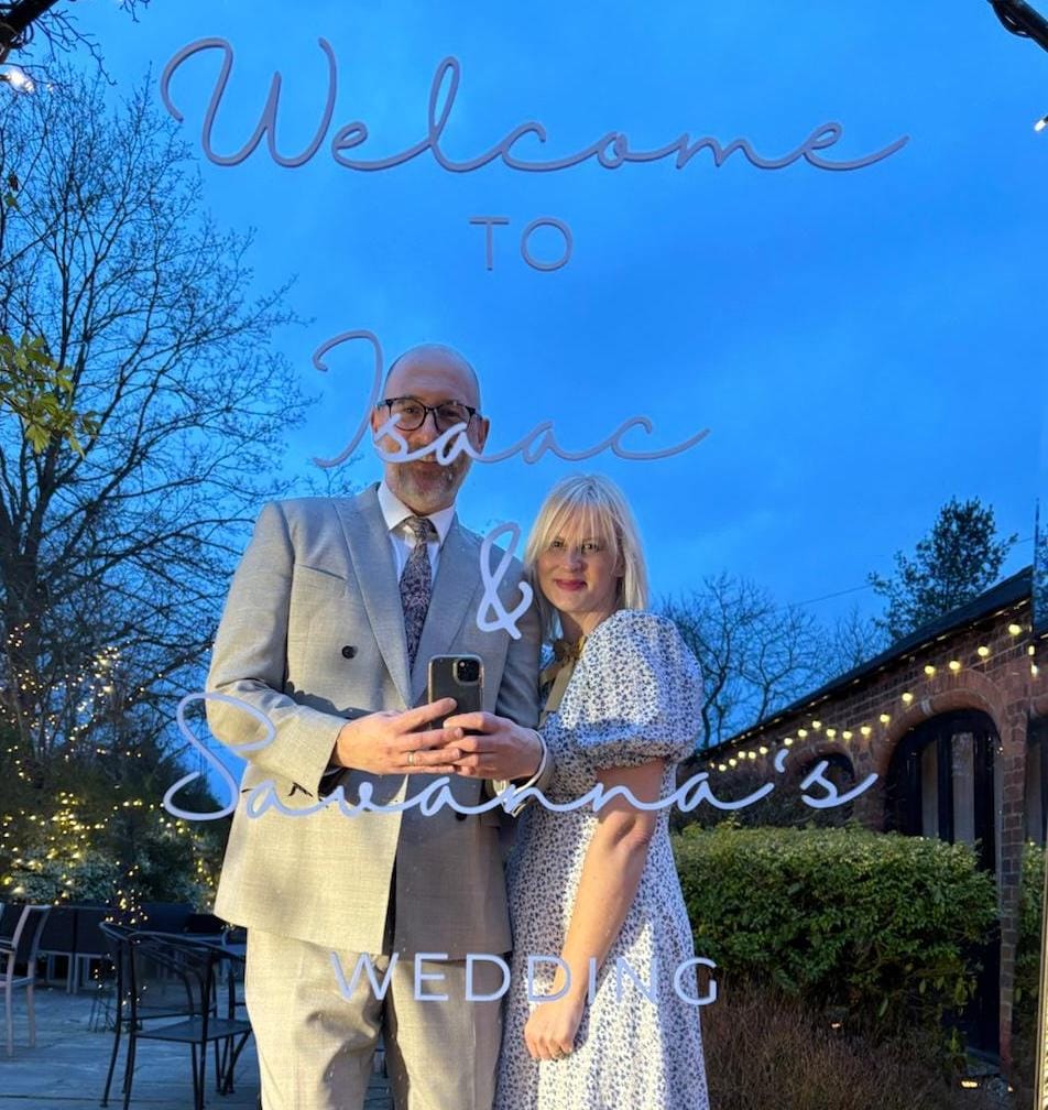 a wedding mirror with custom vinyl decals with the text welcome to -- and -- wedding