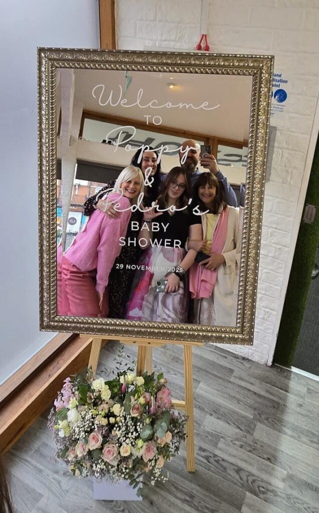 A large mirror with baby shower personalised vinyl decals