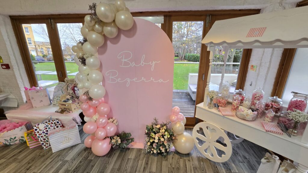 A baby shower oval sign featuring the family surname made in a vinyl decal