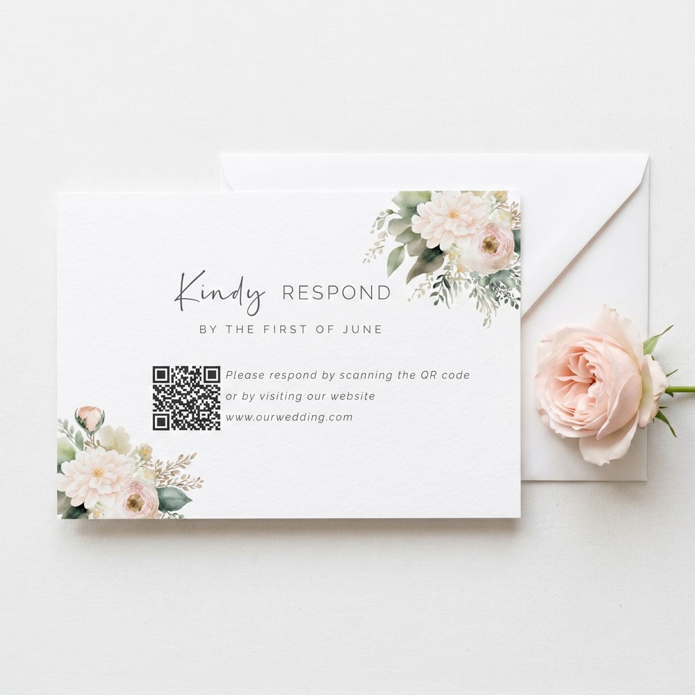 A blush rose themed wedding RSVP card with white envelope