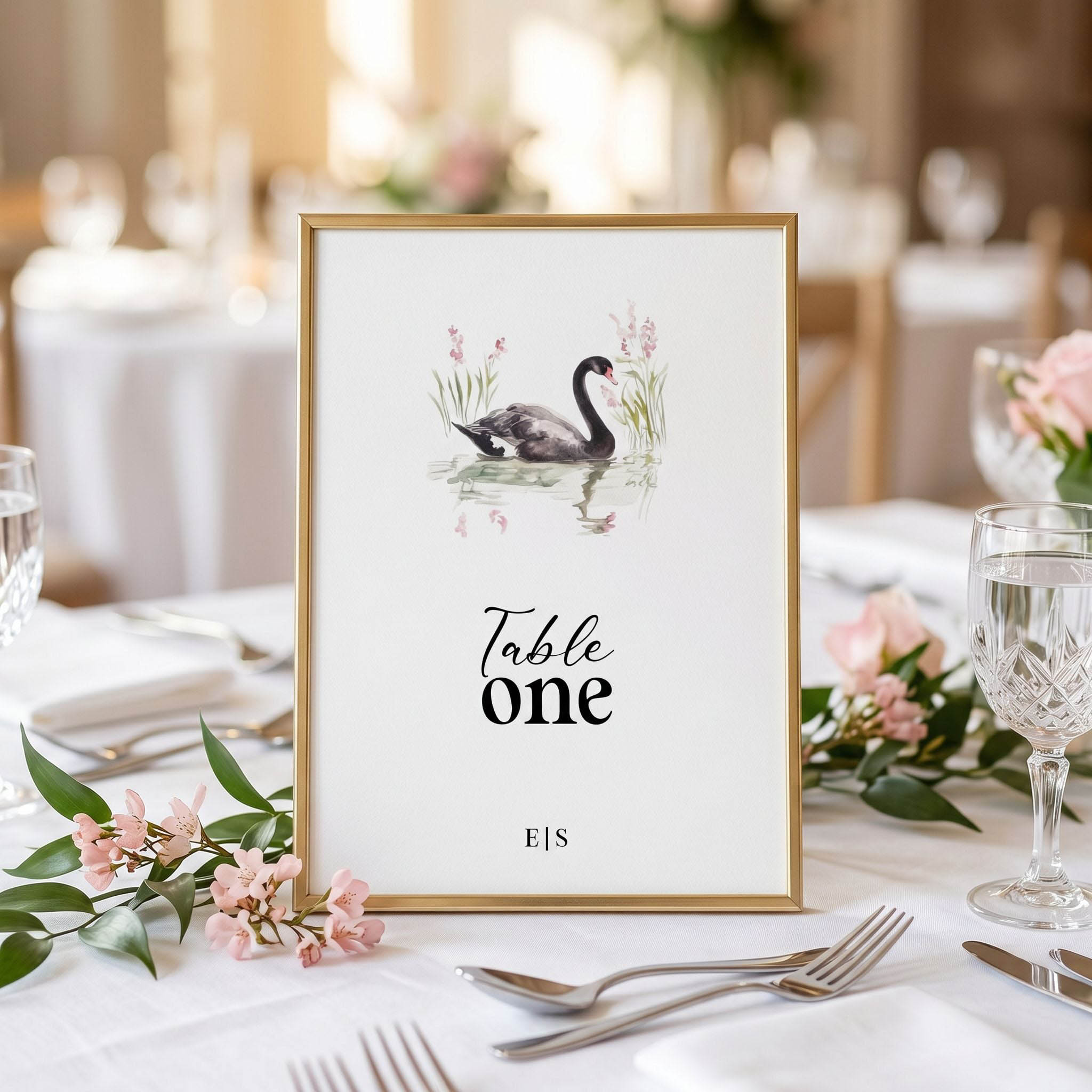 a table number sign with an elegant black swan as part of a country garden themed wedding collection