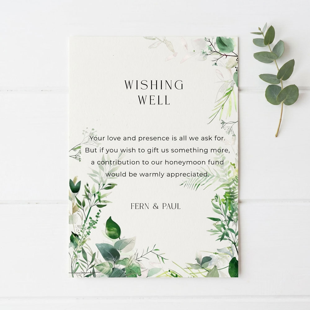 A wishing well wedding card with a botanical green theme