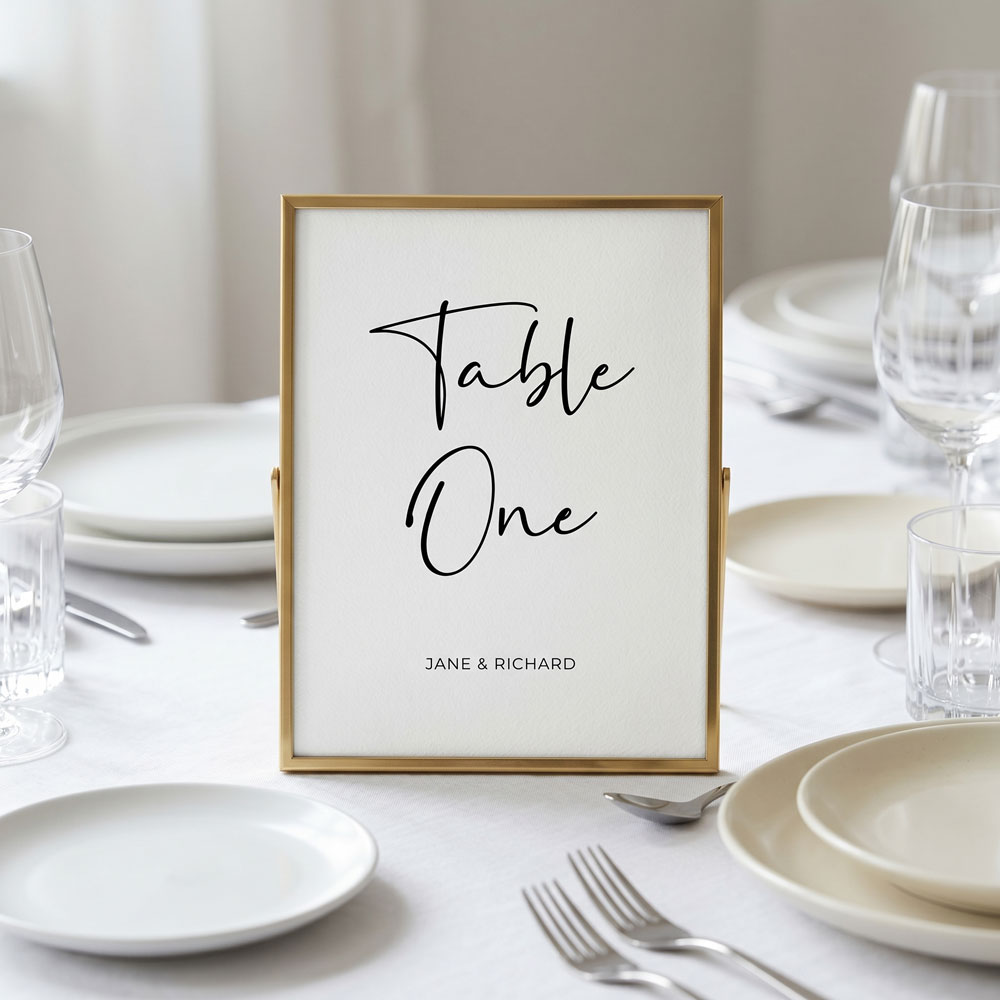 a minimalist table number sign in a frame