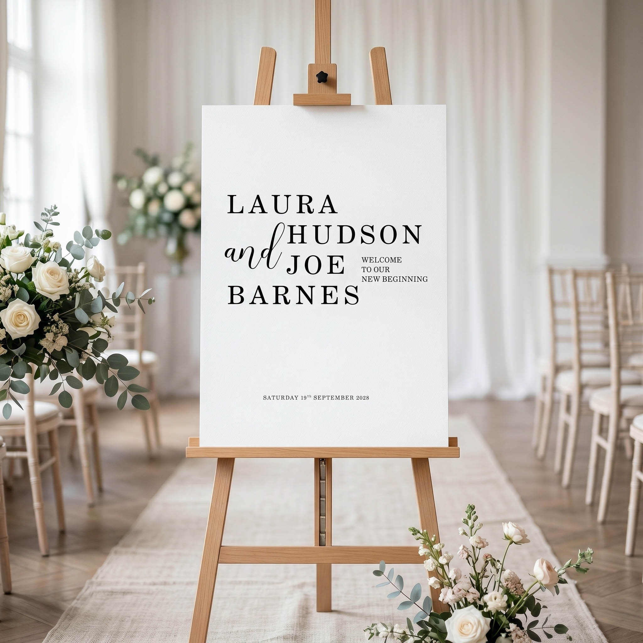 A typography based welcome sign on an easel at a wedding
