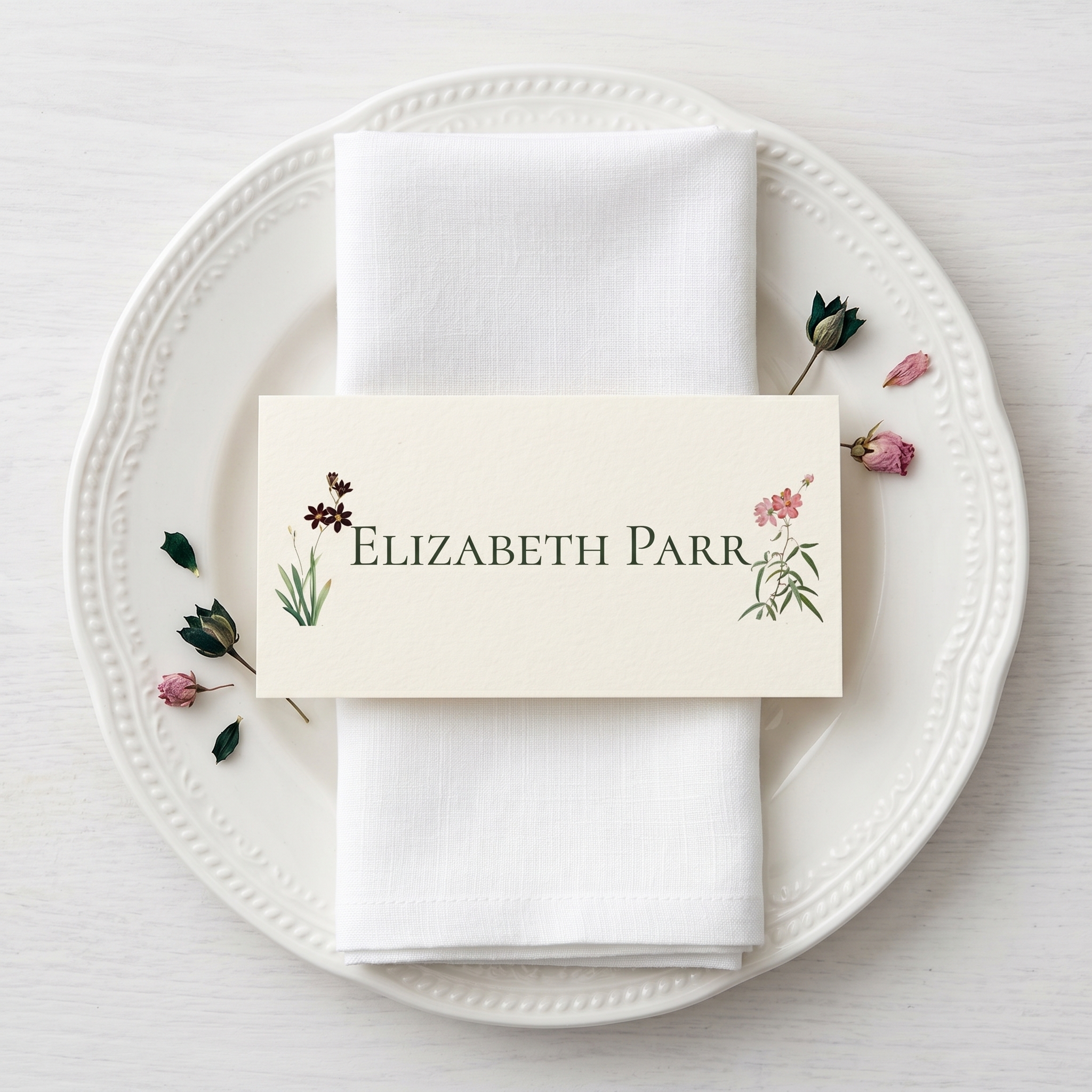 a vintage style floral place card on a white plate